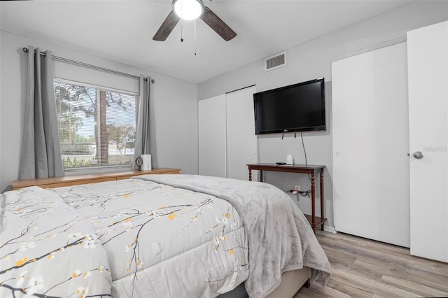 bedroom featuring ceiling fan and light hardwood / wood-style floors