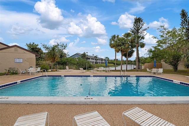 view of swimming pool with a patio area