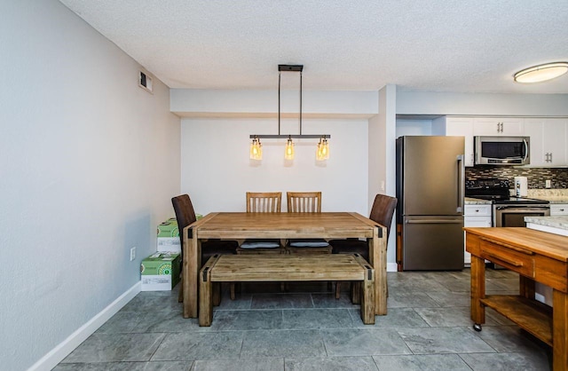 dining area with a textured ceiling