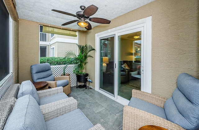 exterior space with ceiling fan, an outdoor living space, and a patio