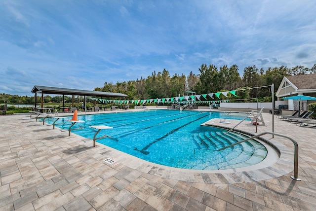 view of swimming pool featuring a patio