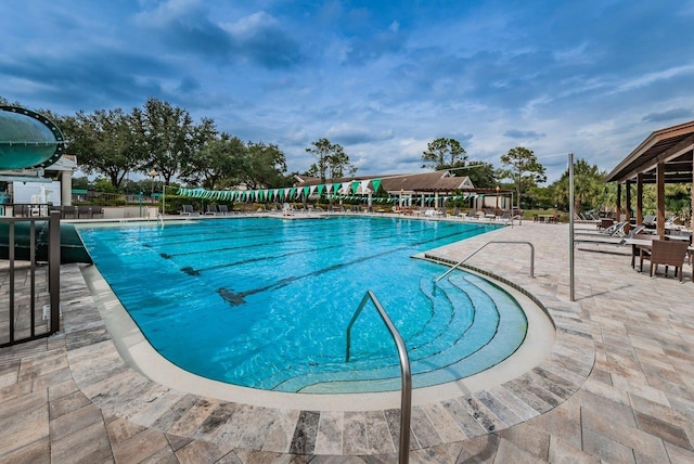 view of swimming pool featuring a patio area