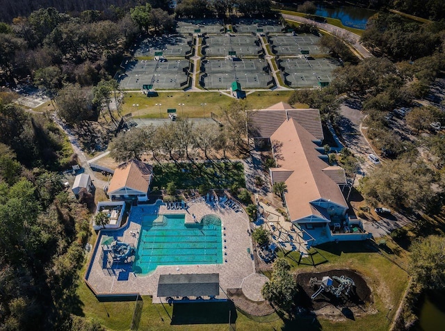 birds eye view of property with a water view