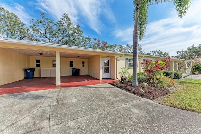 view of front of home with a carport