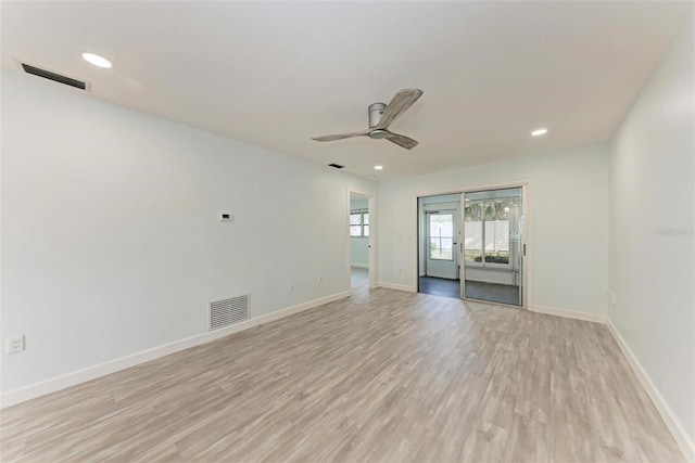 empty room featuring ceiling fan and light hardwood / wood-style flooring