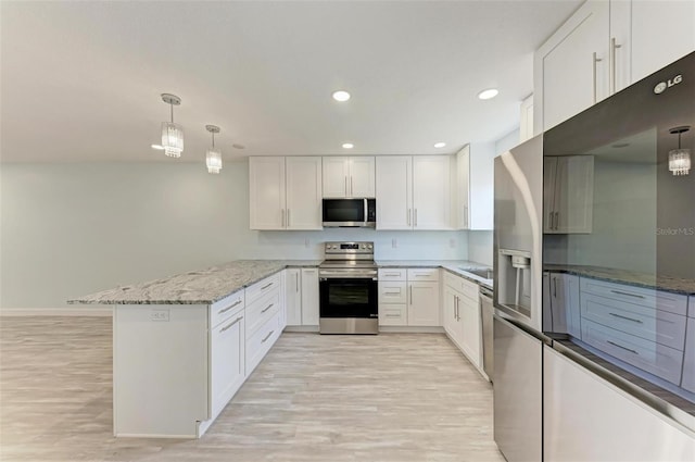 kitchen with light hardwood / wood-style floors, stainless steel appliances, kitchen peninsula, pendant lighting, and white cabinets