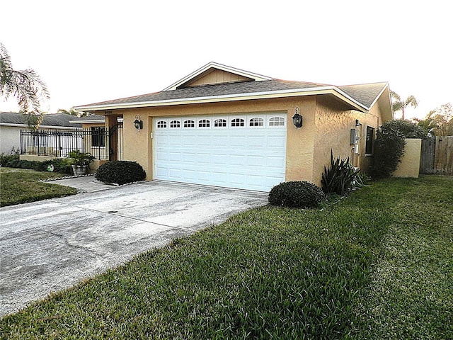 view of front of house with a front lawn and a garage