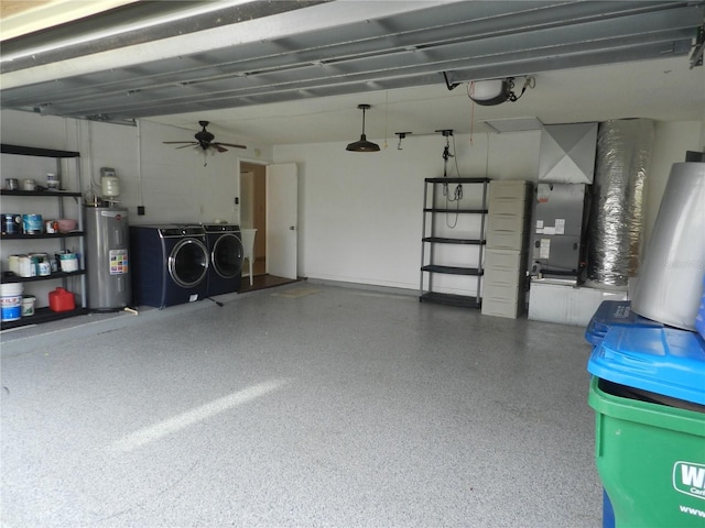 garage featuring a ceiling fan, a garage door opener, heating unit, water heater, and separate washer and dryer