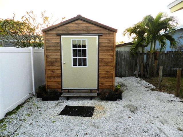 view of shed with a fenced backyard