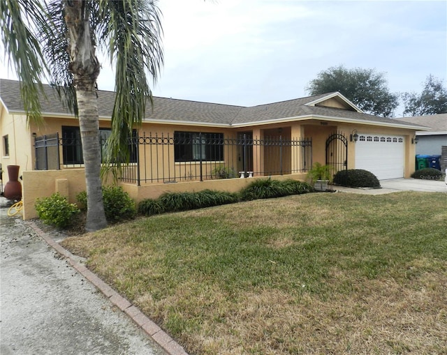 single story home with a fenced front yard, an attached garage, concrete driveway, stucco siding, and board and batten siding