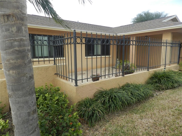 view of gate with fence