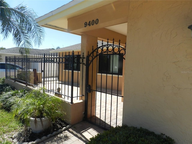 view of gate with fence