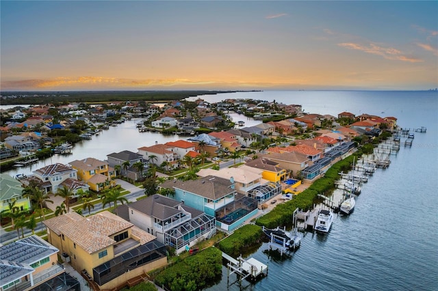 aerial view at dusk with a water view