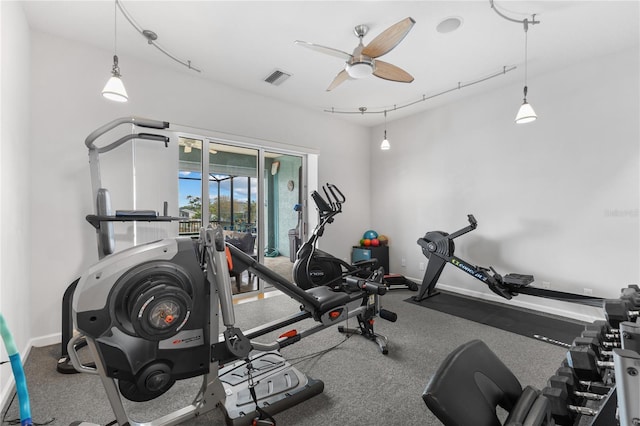 workout area with ceiling fan