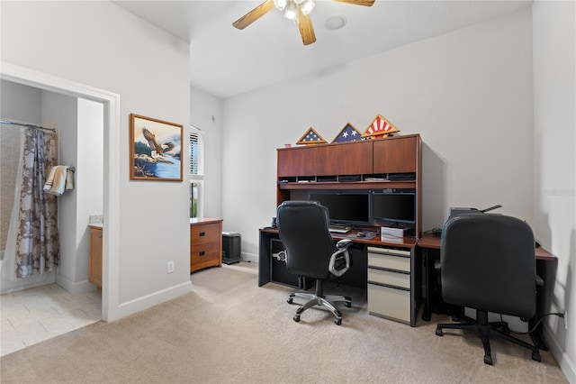 office with light carpet and ceiling fan