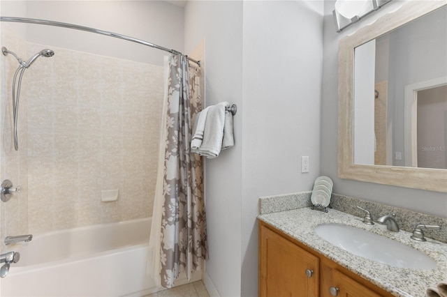 bathroom featuring shower / tub combo and vanity