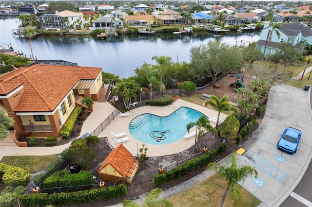 birds eye view of property featuring a water view