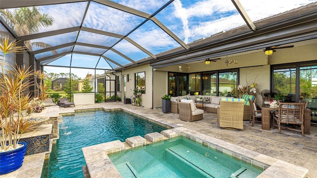 view of pool featuring a lanai, a patio, an in ground hot tub, and outdoor lounge area