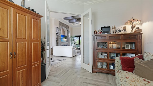 hallway featuring light parquet flooring and crown molding