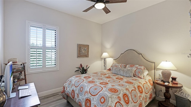 bedroom featuring ceiling fan and hardwood / wood-style floors