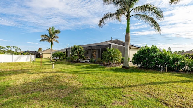 view of yard with a lanai