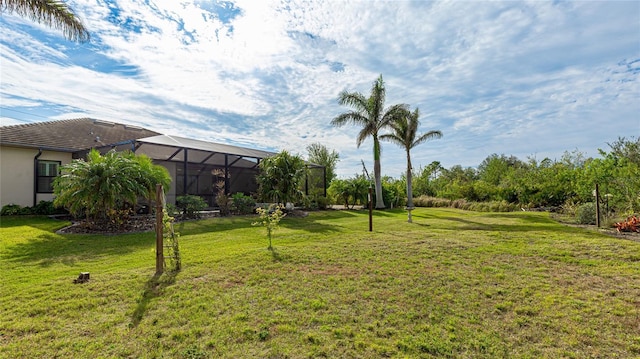 view of yard with a lanai