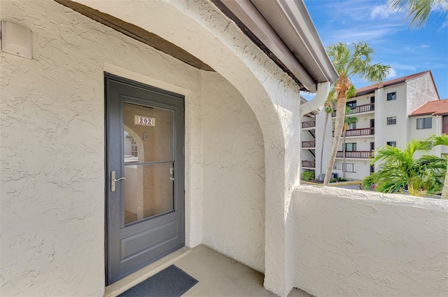 property entrance with a balcony