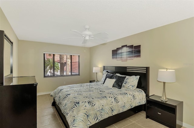 tiled bedroom with ceiling fan