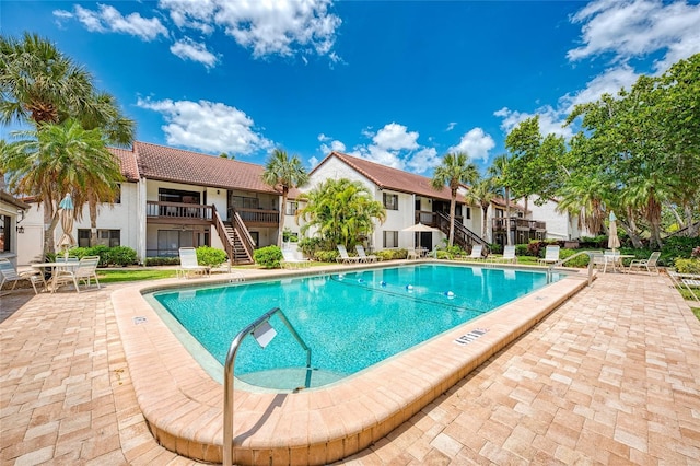 view of swimming pool with a patio