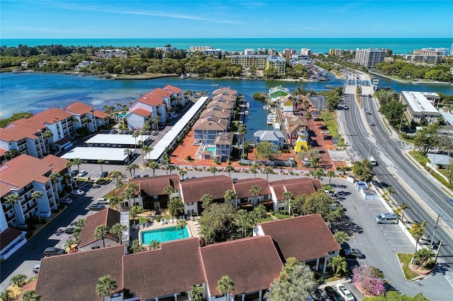 birds eye view of property with a water view