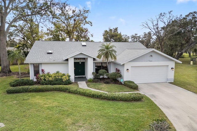 single story home with a garage and a front lawn