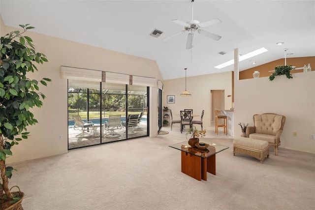 carpeted living room with vaulted ceiling and ceiling fan