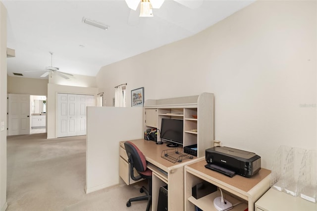 carpeted home office featuring lofted ceiling