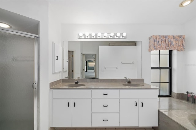 bathroom with vanity and an enclosed shower