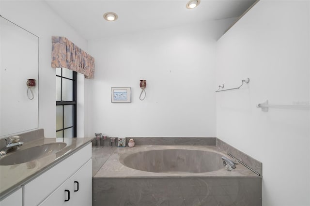 bathroom featuring a bathtub and vanity