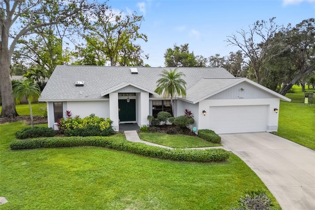 ranch-style house with a front yard and a garage