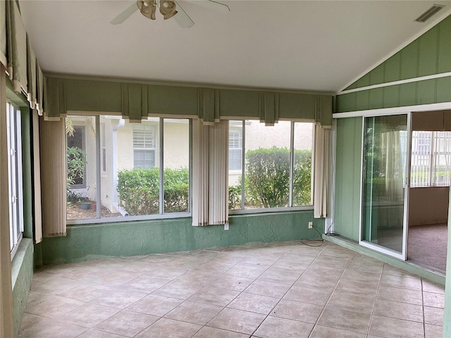 unfurnished sunroom featuring ceiling fan and lofted ceiling