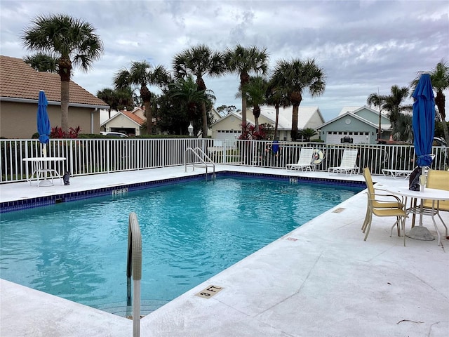 view of swimming pool with a patio