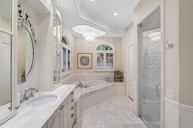 bathroom featuring a notable chandelier, ornamental molding, a shower stall, a bath, and vanity