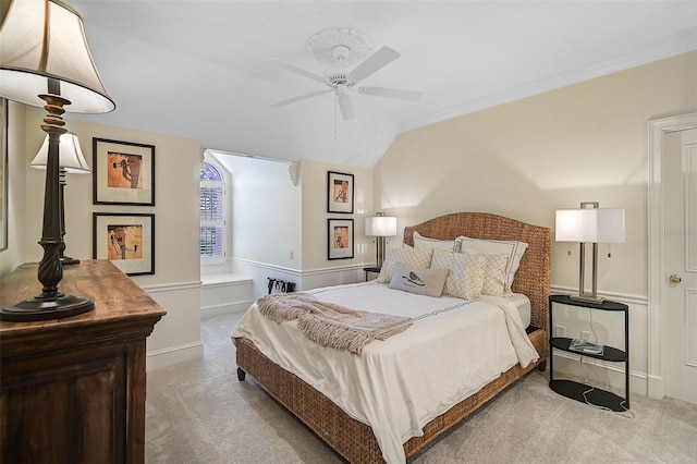 carpeted bedroom featuring ceiling fan and vaulted ceiling