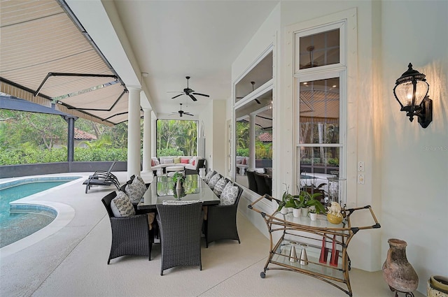 view of patio featuring an outdoor pool, outdoor lounge area, and ceiling fan