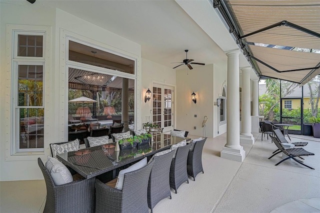 view of patio / terrace featuring french doors, outdoor dining area, and a ceiling fan