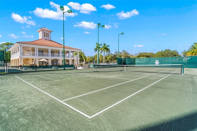 view of tennis court with fence