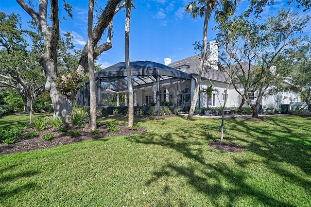 view of yard with a lanai