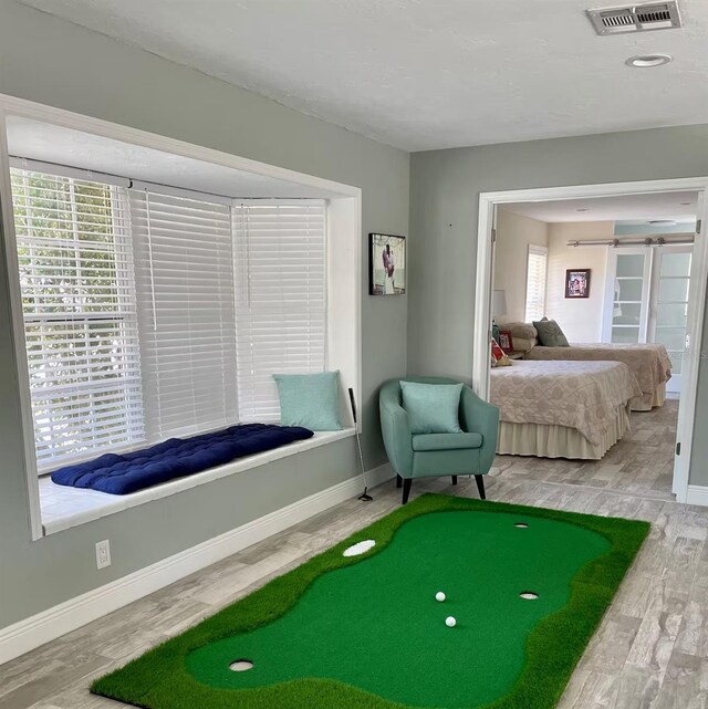 bedroom with hardwood / wood-style floors