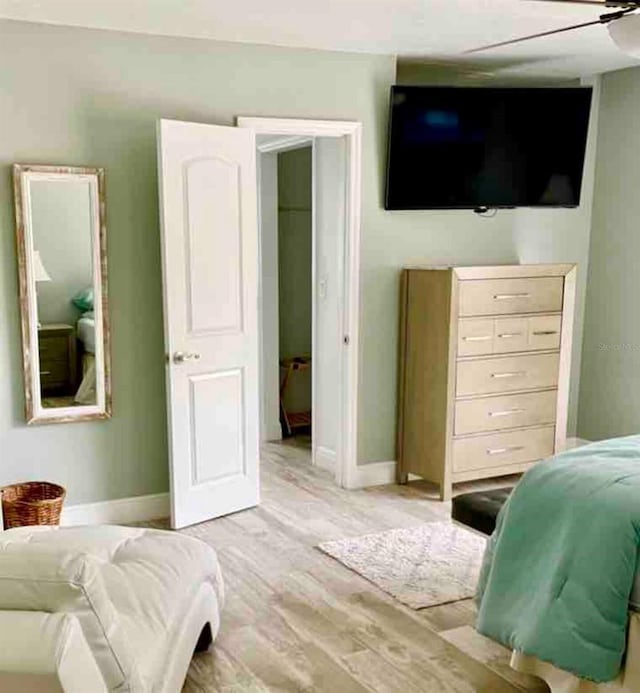 bedroom featuring ceiling fan and light hardwood / wood-style flooring