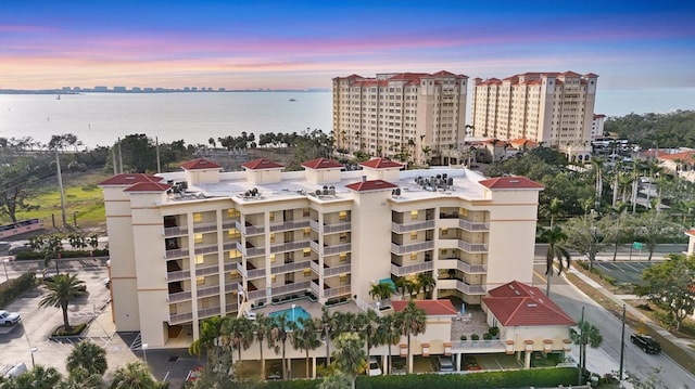 outdoor building at dusk featuring a water view