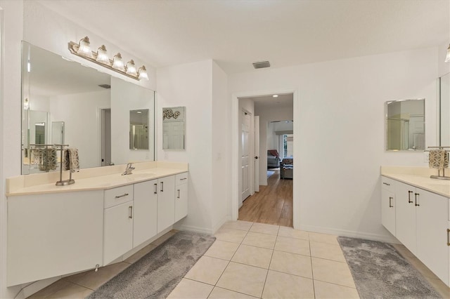 bathroom with vanity and tile patterned floors