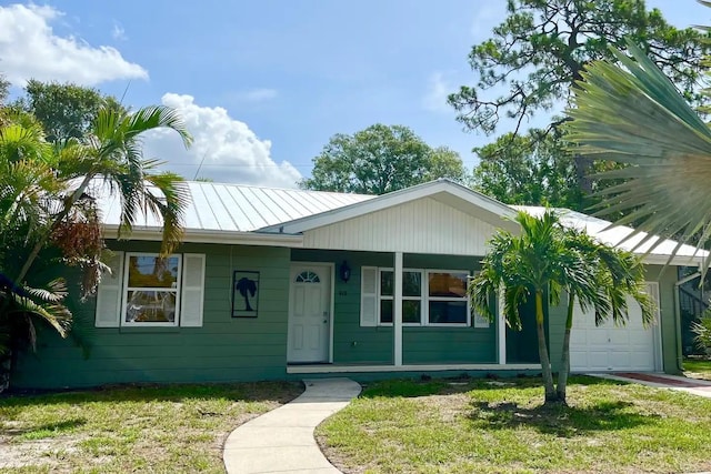 ranch-style home with a front lawn and a garage