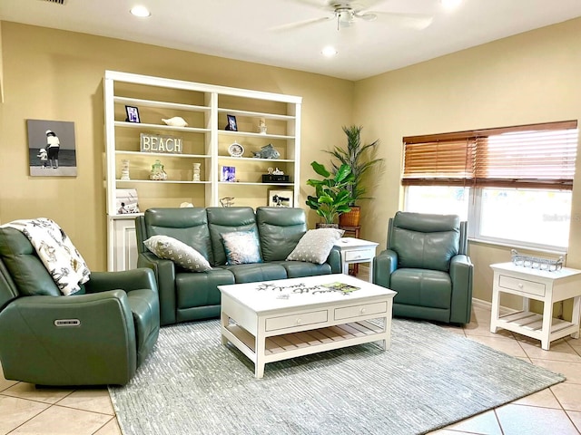 living room featuring ceiling fan and light tile patterned floors